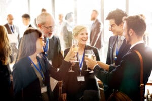 Conference attendees networking at a business event, showing what makes a good conference for attendees